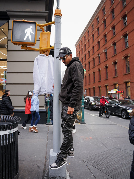3-Pack Premium 340 GSM Heavyweight Hoodie Bundle — model wearing black hoodie NYC street