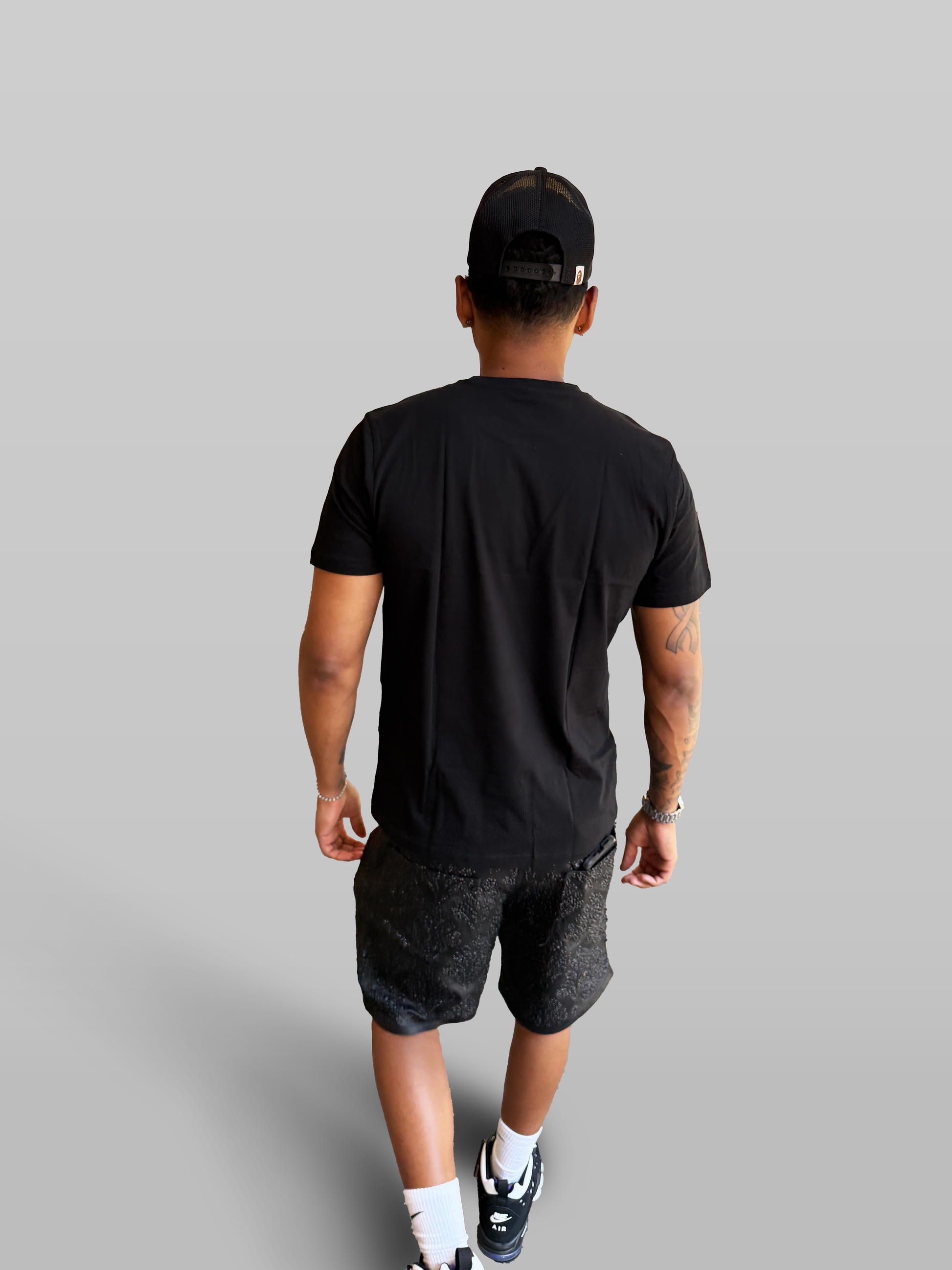 Premium Tee — black studio back